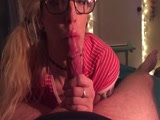 Nerdy looking babe giving blowjob
